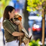 Woman snuggles her dog in Boston.
