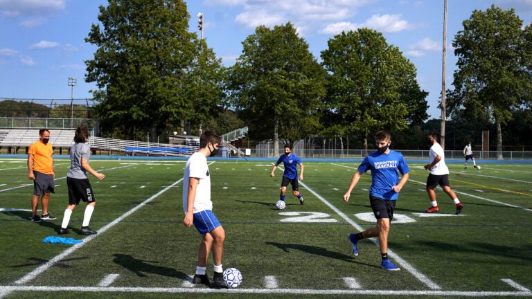 Braintree High Schools' soccer coach oversees team tryouts.