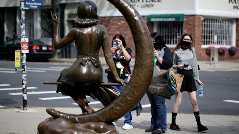 Visitors at the Samantha statue in Salem.