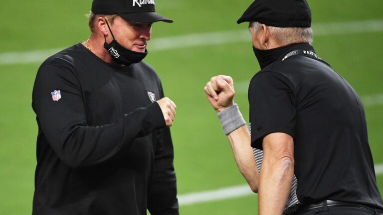 Head coach Jon Gruden of the Tampa Bay Buccaneers shakes hands