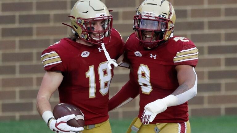 Boston College defensive back Mike Palmer celebrates his touchdown with Jahmin Muse.