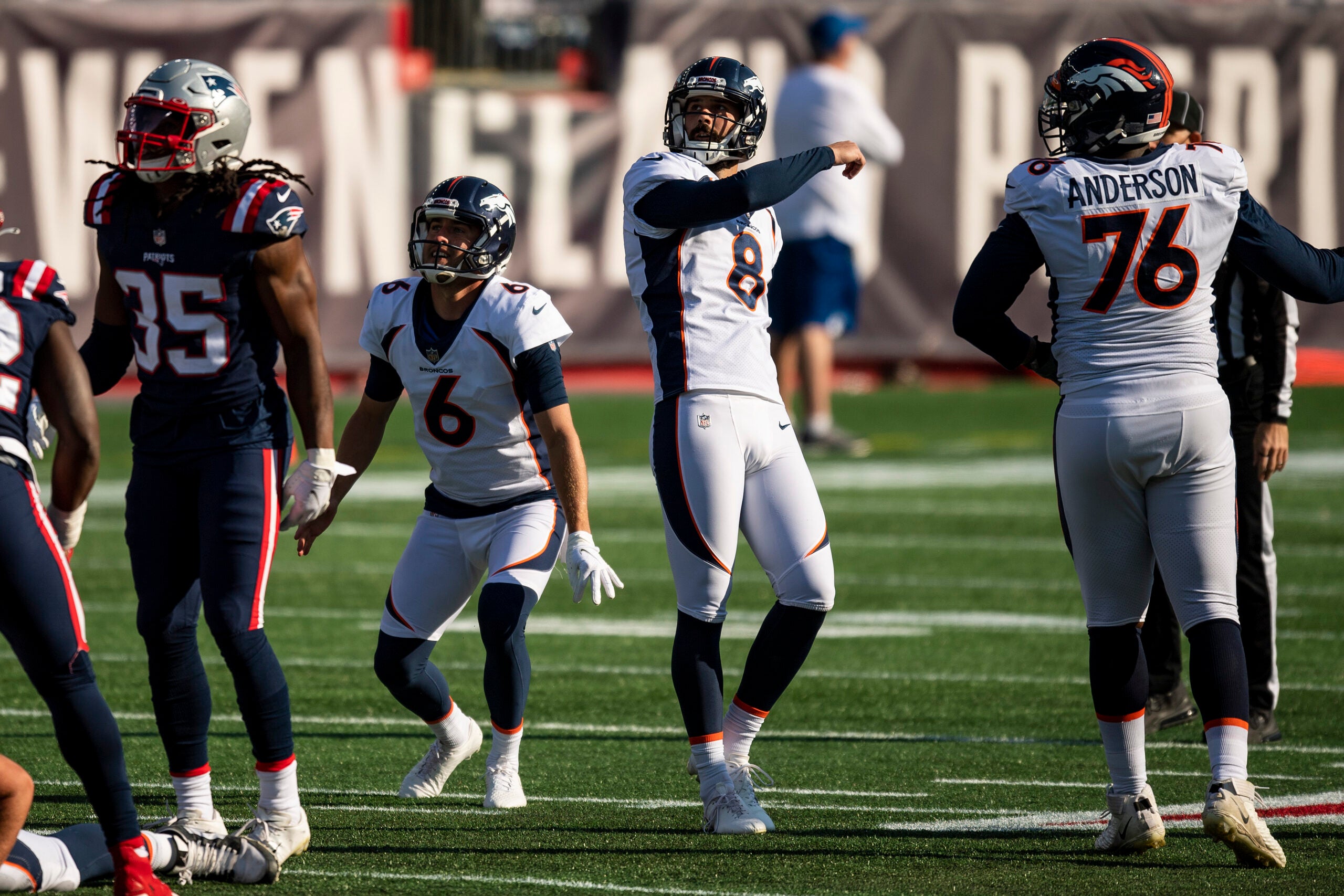 Denver Broncos place kicker Brandon McManus (8) kicks the ball