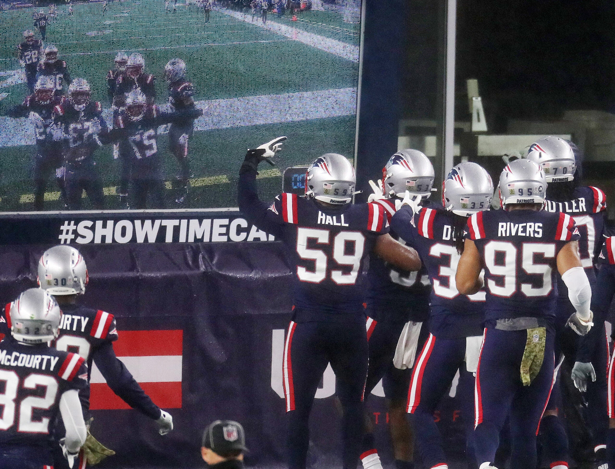 Cam Newton helps Patriots beat Ravens in rain and wind