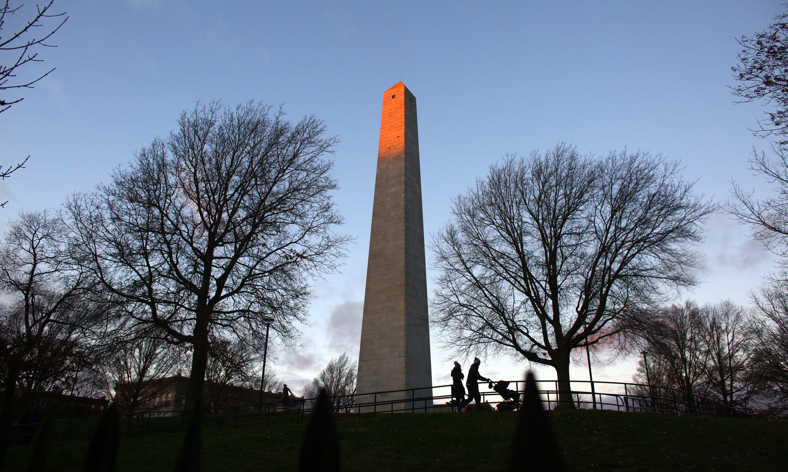 People stroll around the Bunker Hill Monument.
