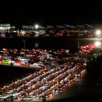 Motorists line up to take a coronavirus test in a parking lot at Dodger Stadium on Jan. 4.