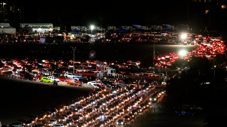 Motorists line up to take a coronavirus test in a parking lot at Dodger Stadium on Jan. 4.