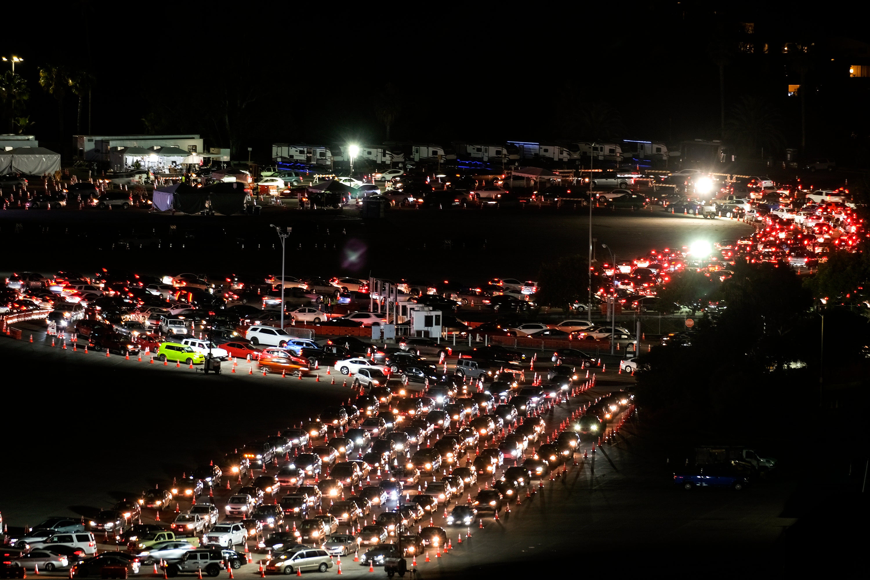 Motorists line up to take a coronavirus test in a parking lot at Dodger Stadium on Jan. 4.