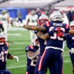 Devin Asiasi reacts after scoring a touchdown.