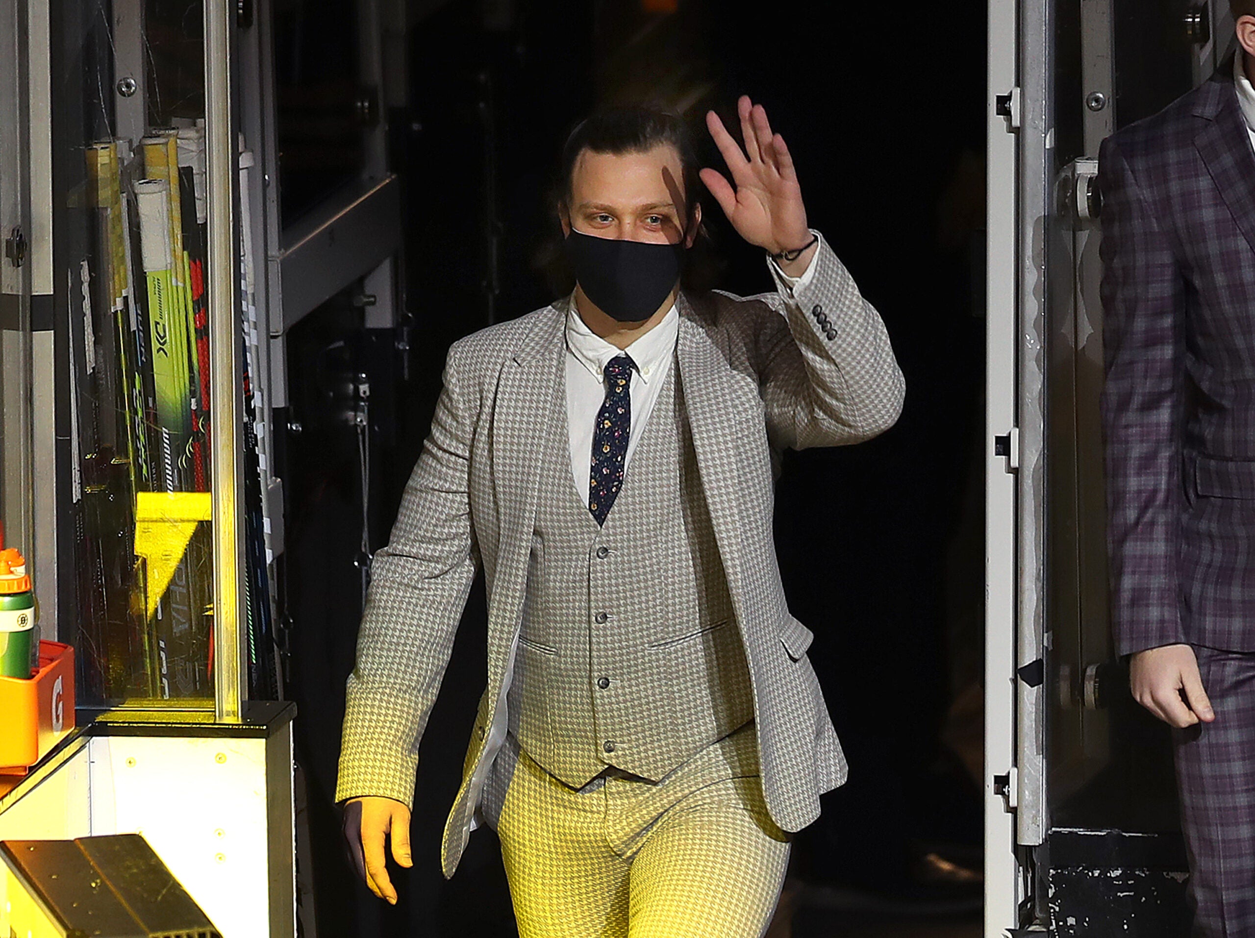 David Pastrnak of the Boston Bruins wears a holiday suit before