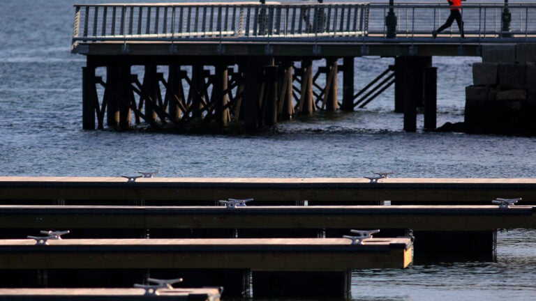 Boston, MA - 01/12/21 - A runner enjoyed views of Boston Harbor as he traversed the Harbor Walk near the Institute of Contemporary Art in the Seaport District. A partly-sunny day in Boston saw temperatures creep into the 40s. (Lane Turner/Globe Staff) Reporter: (in caps) Topic: ()
