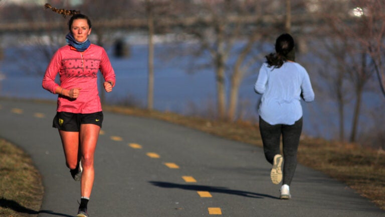 Runners along Memorial Drive in Cambridge.