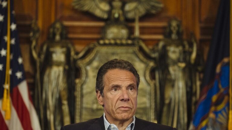 Former aide says andrew cuomo kissed her, suggested strip poker