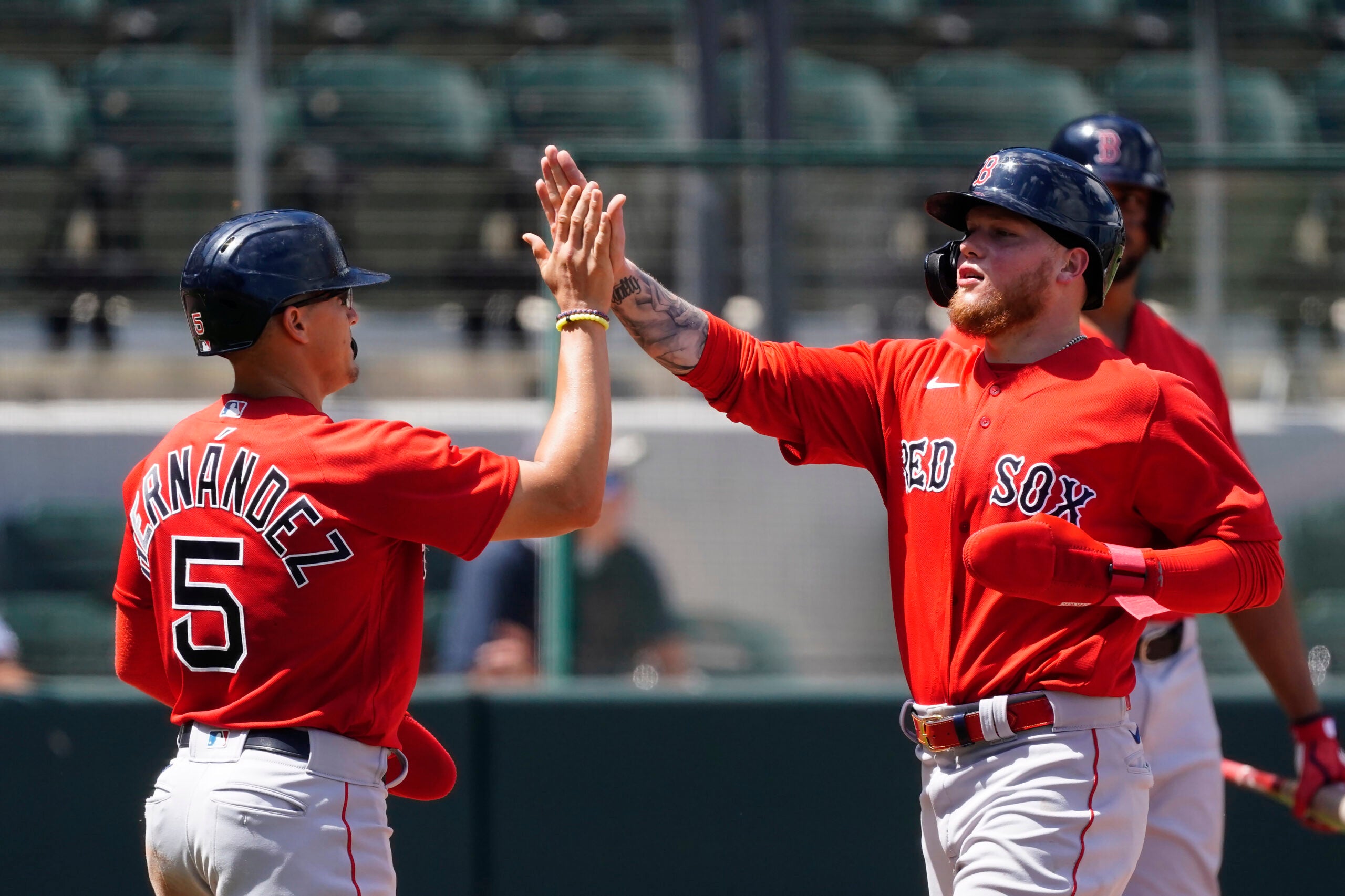 Boston Red Sox's Bobby Dalbec celebrates with Enrique Hernandez