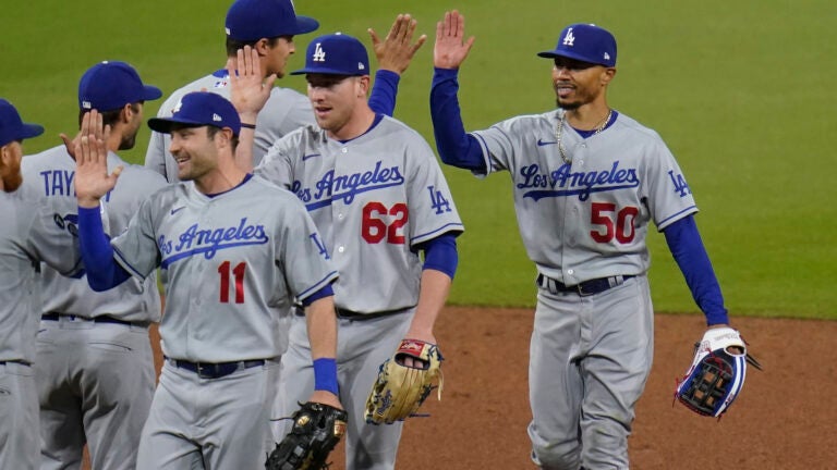 Mookie Betts of the Los Angeles Dodgers celebrates after catching