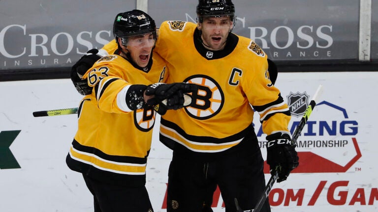 Brad Marchand's Hat Trick Carries Bruins Past Penguins, 7-5