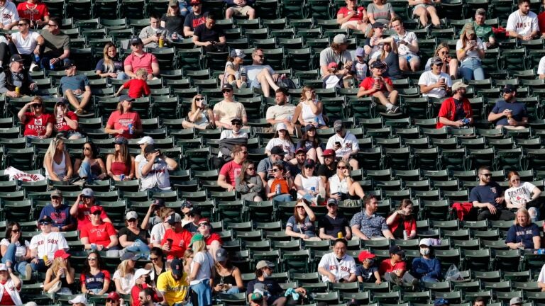 Clubhouse attendant packs up Red Sox gear, at Fenway - Digital Commonwealth