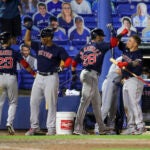 J.D. Martinez (28) celebrates his two-run home run with Michael Chavis, Rafael Devers, and Christian Vazquez.