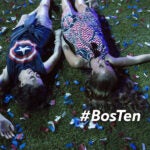 People lie on confetti after the Independence Day celebrations near the Hatch Shell along the Charles River Esplanade.