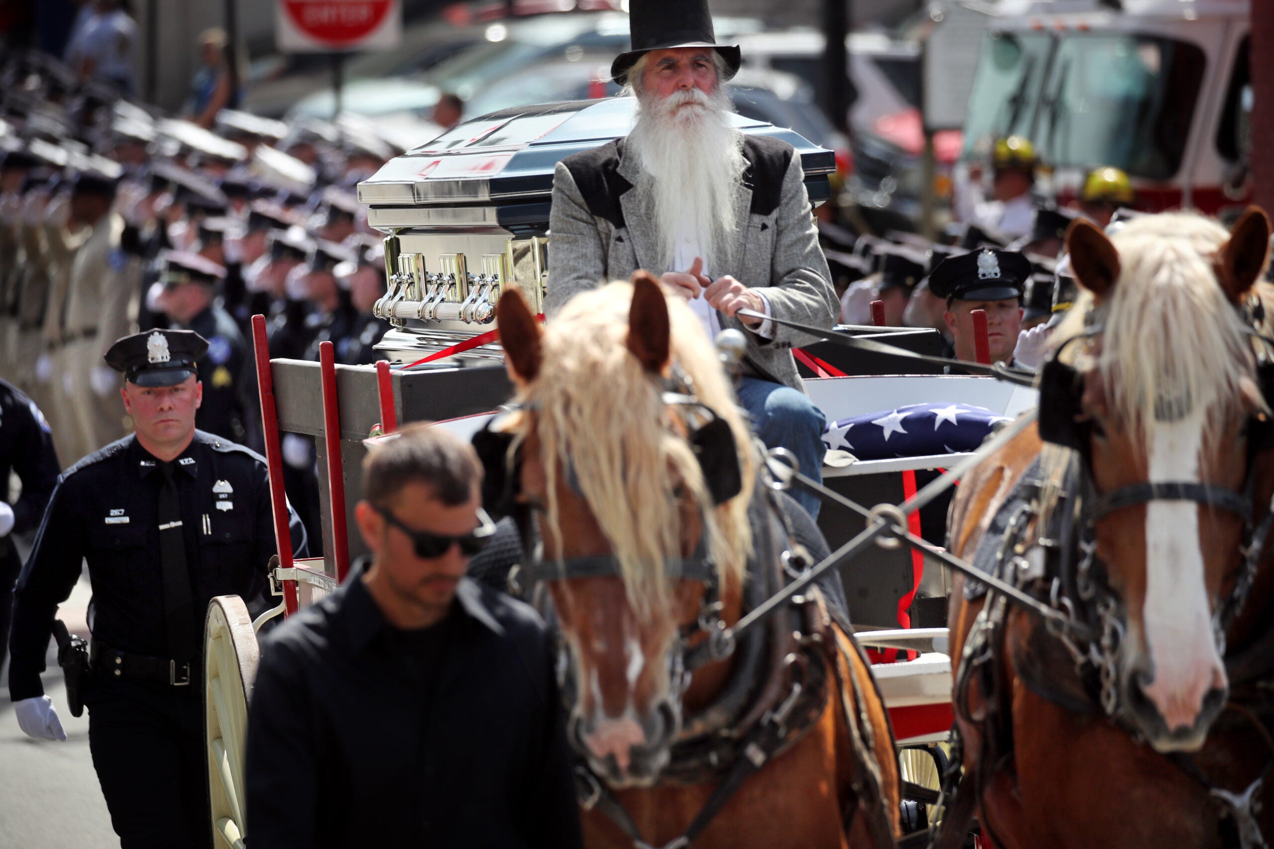 City honors officer who died trying to save drowning
boy 8