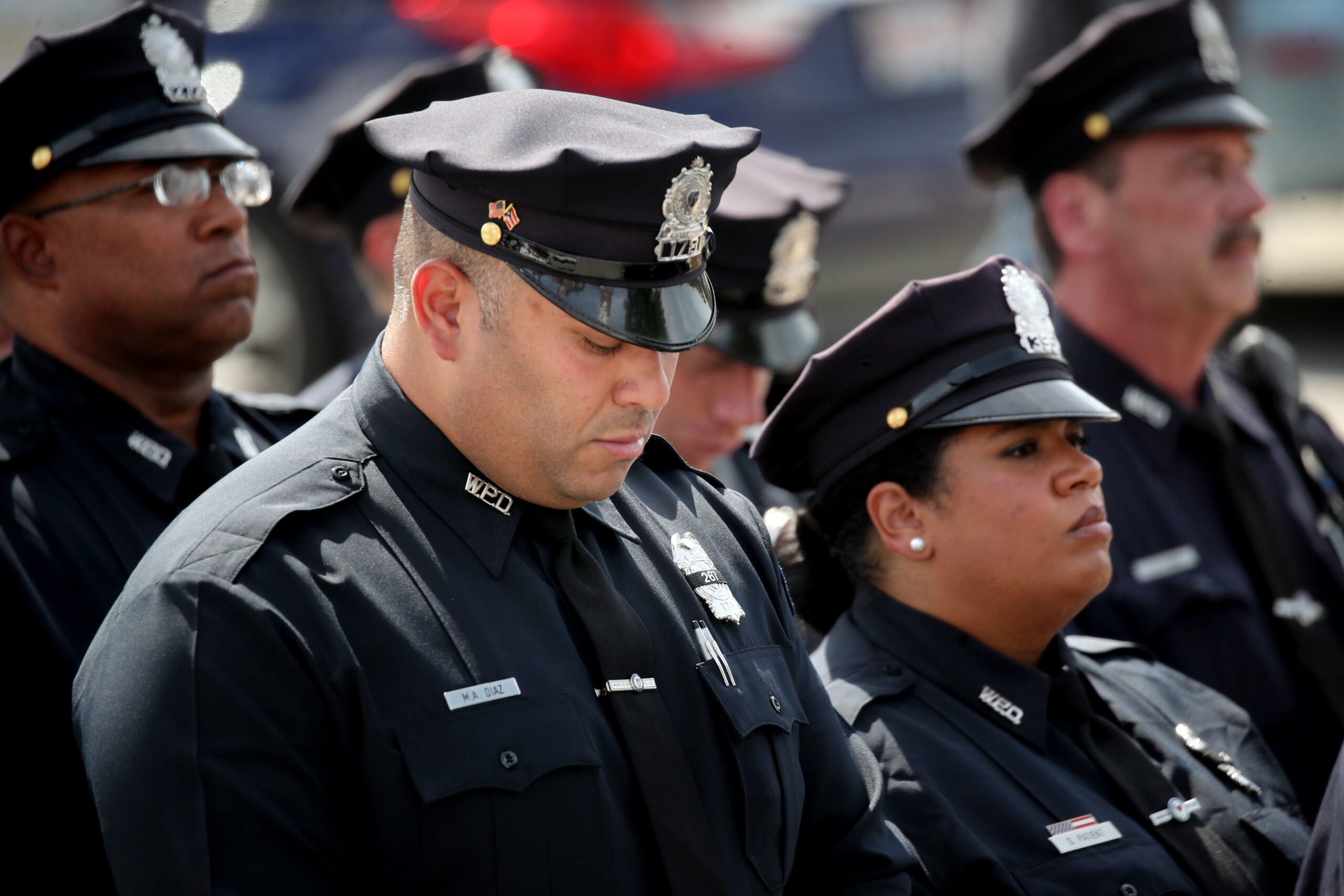 City honors officer who died trying to save drowning
boy 10