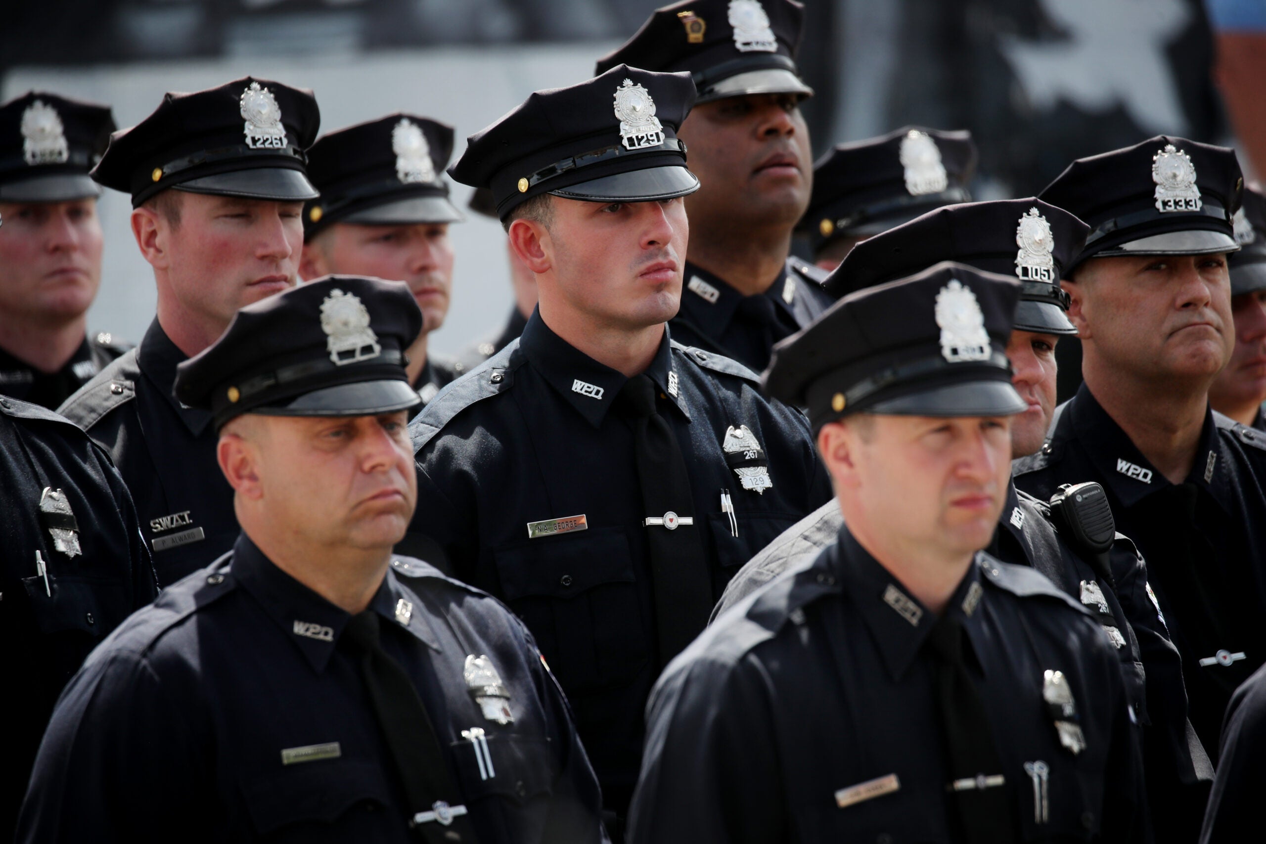 City honors officer who died trying to save drowning
boy 11