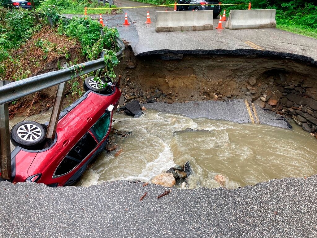 Storms wash out bridges, roads, floods basements across New England