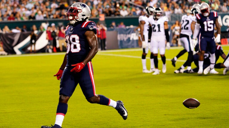 New England Patriots fullback Jakob Johnson, right, dives for the ball  against Tampa Bay Buccan …