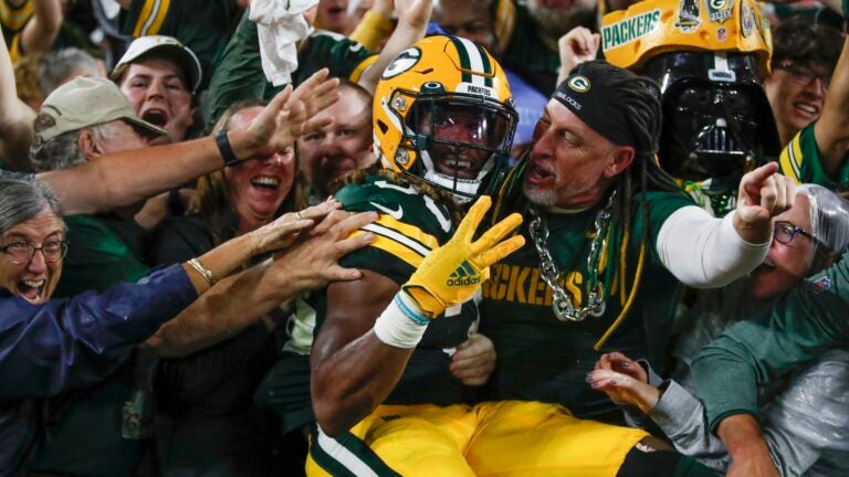 Green Bay Packers' Aaron Jones celebrates his touchdown run during the second half of an NFL football game against the Detroit Lions Monday, Sept. 20, 2021, in Green Bay, Wis.