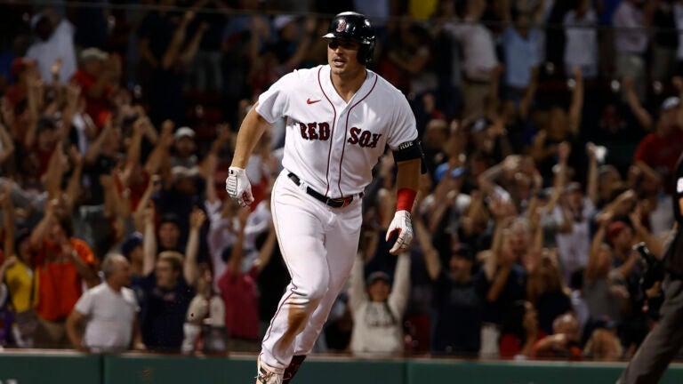 Hunter Renfroe of the Boston Red Sox breaks a baseball hat over