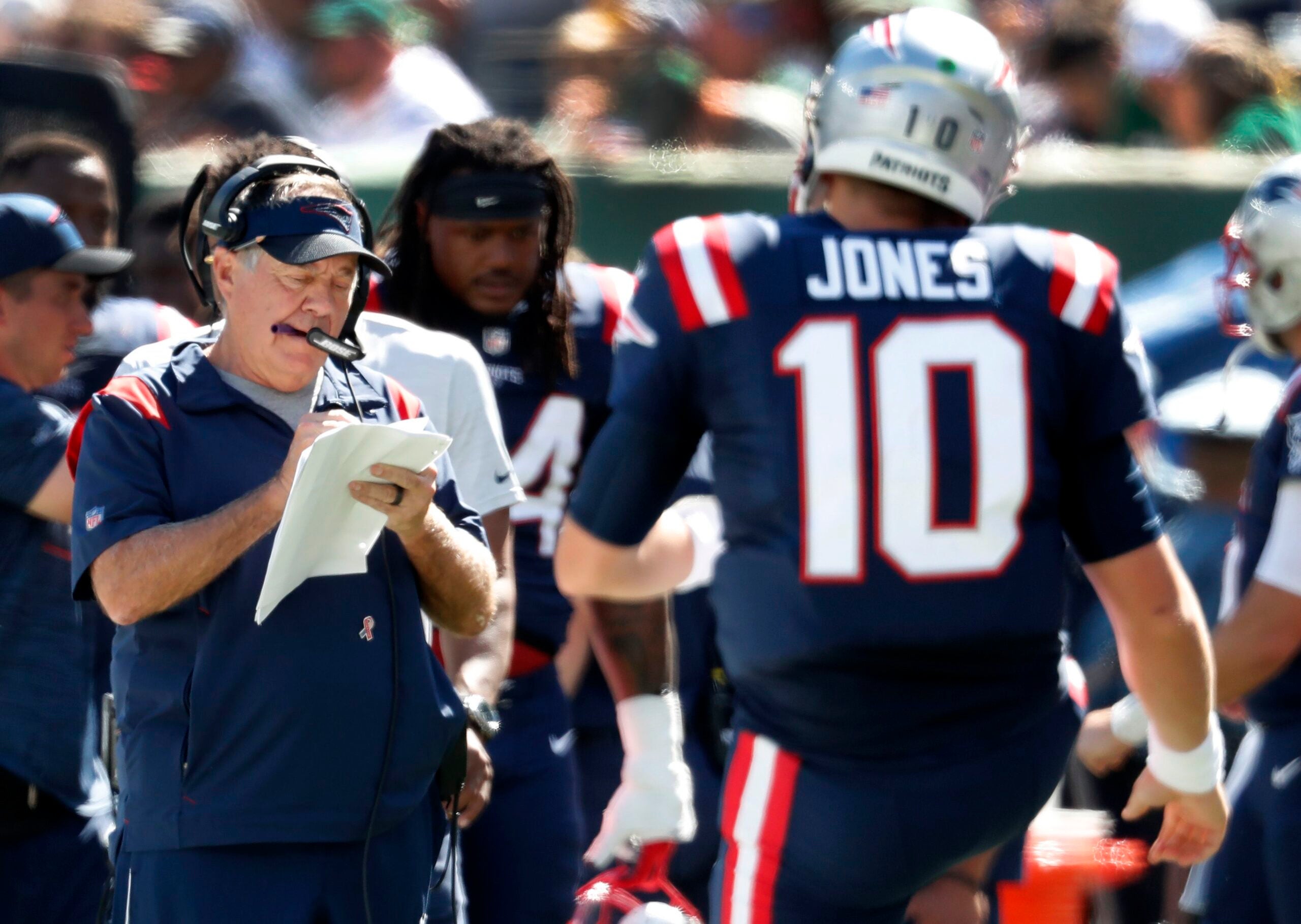 Mac Jones injury: Patriots QB flew back with team, but no 'up-to-the-second  update,' Bill Belichick says 