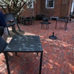 Ristorante Lucia restaurant's owner, Philip Frattaroli sets up tables in the courtyard