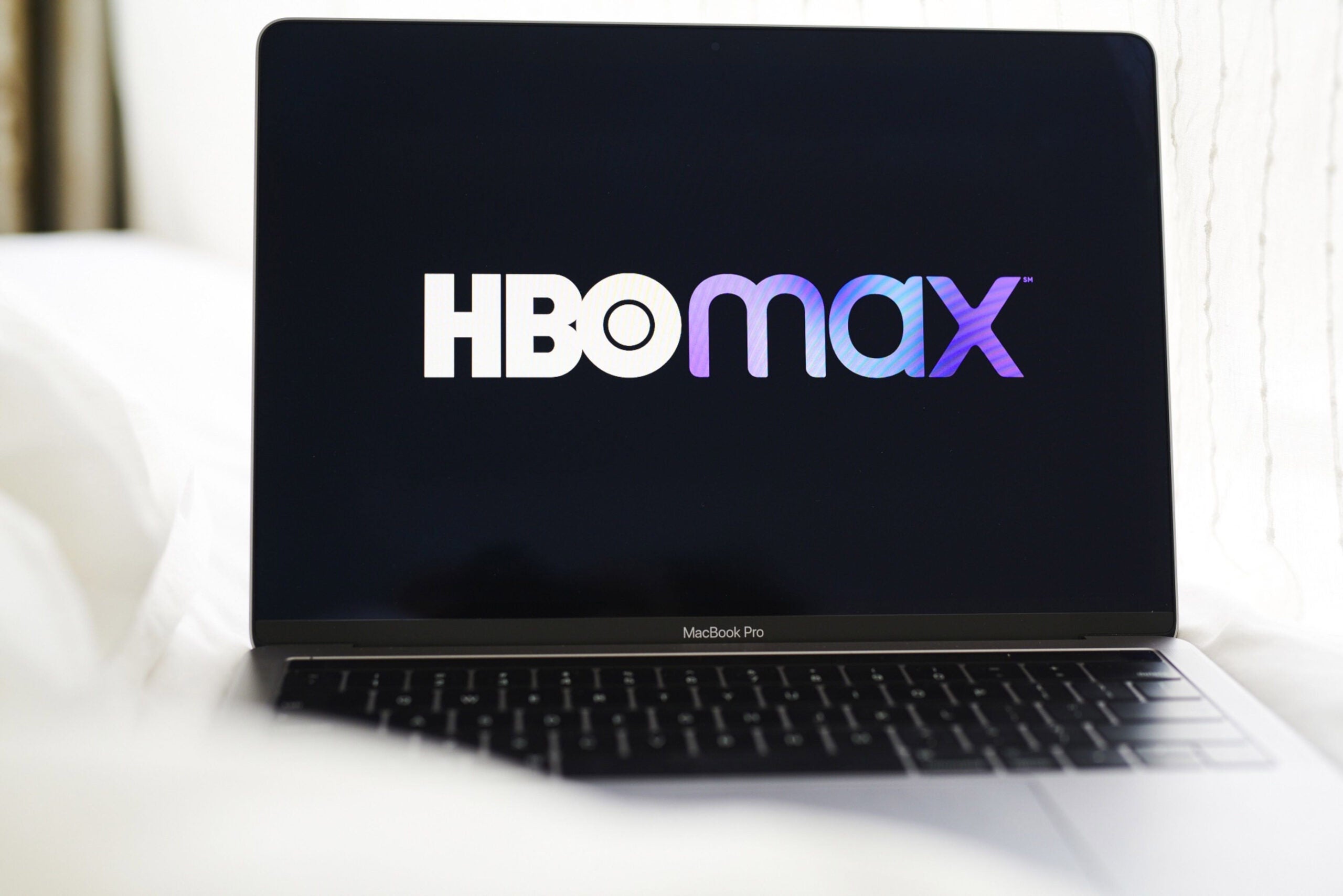 The logo for HBO Max on a laptop computer.
