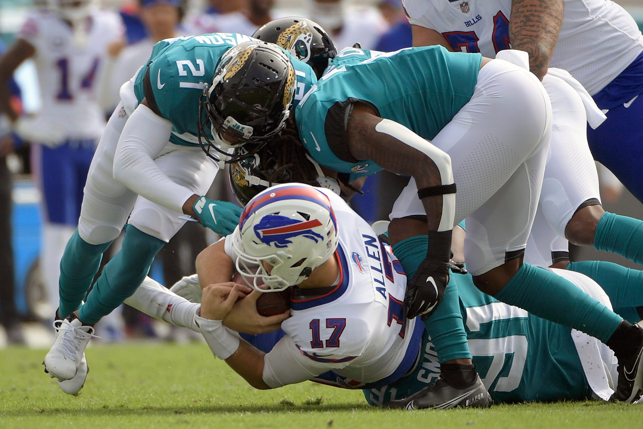 Buffalo Bills safety Jaquan Johnson (4) runs onto the field before the  start of an NFL