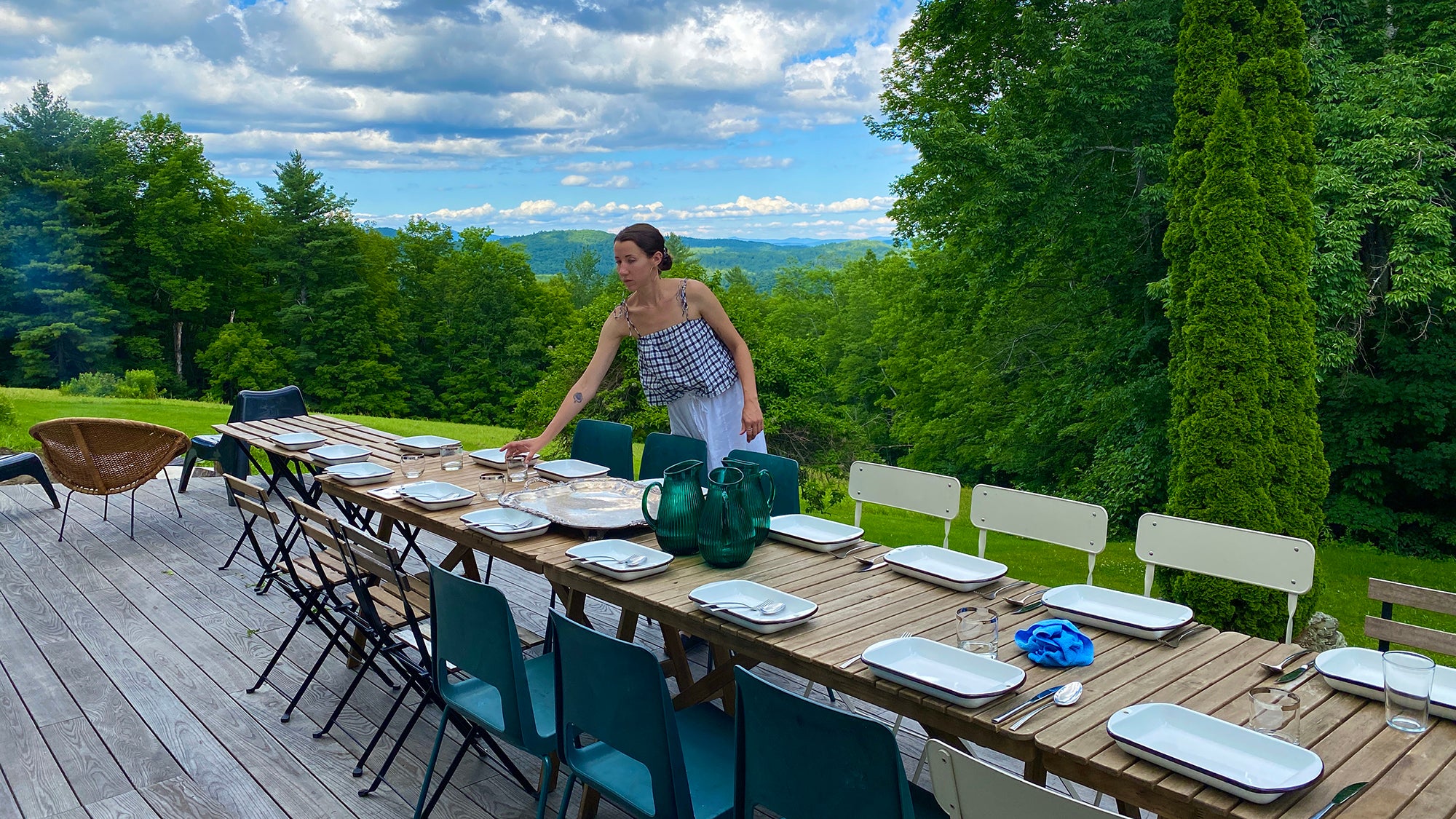 Sommelier Amanda Geller helps prepare the table at Esmeralda restaurant in Andover, Vermont