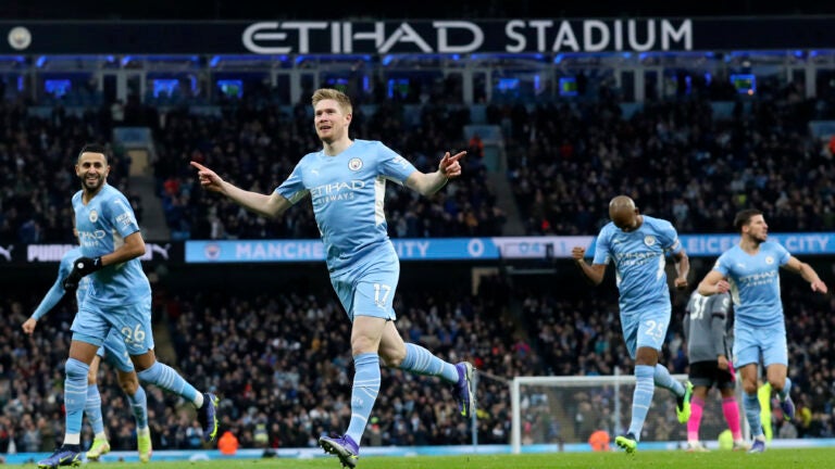 Manchester City's Kevin De Bruyne, center, celebrates after scoring the opening goal during the English Premier League soccer match between Manchester City and Leicester City at Etihad stadium in Manchester, England, Sunday, Dec. 26, 2021.