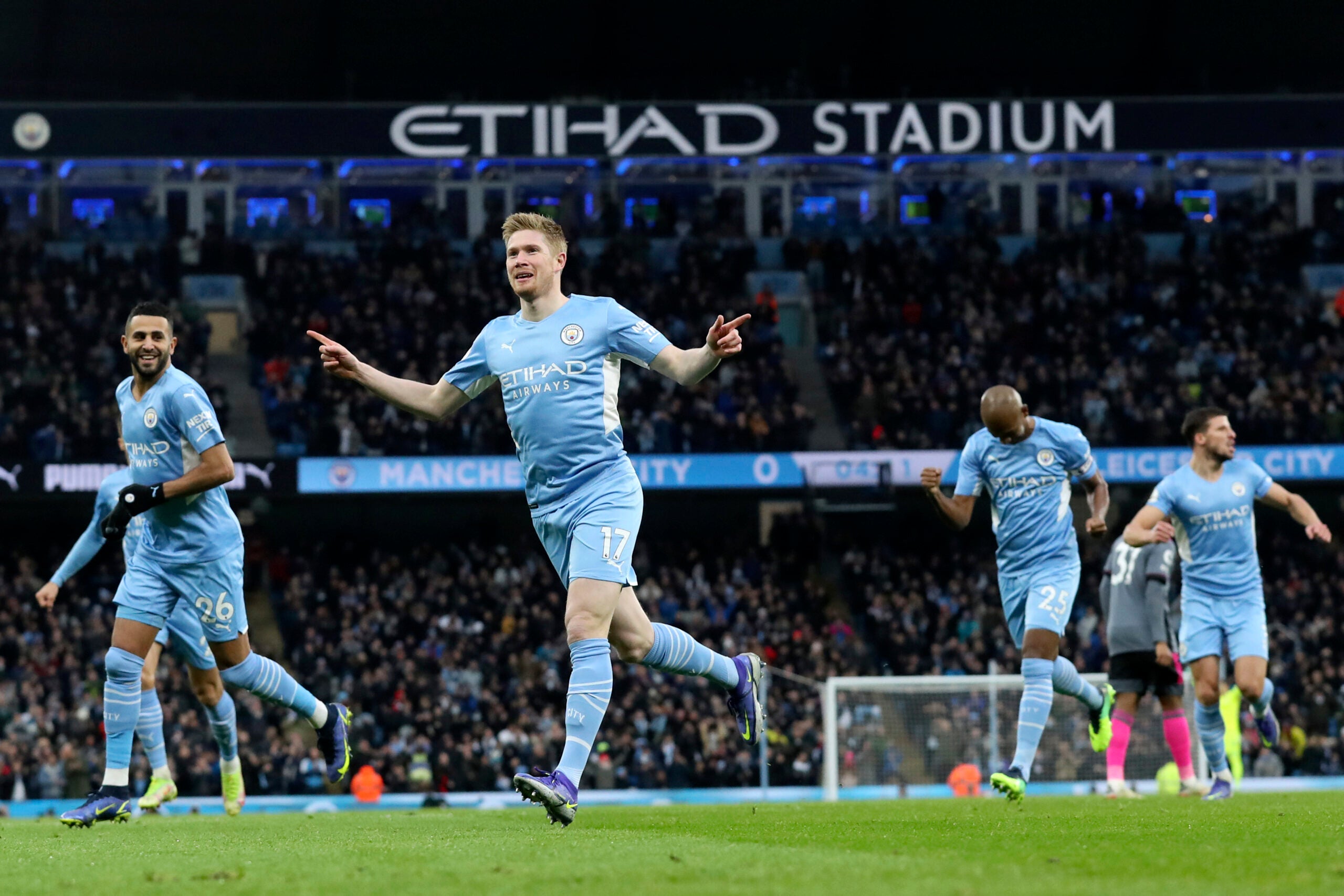 Manchester City's Kevin De Bruyne, center, celebrates after scoring the opening goal during the English Premier League soccer match between Manchester City and Leicester City at Etihad stadium in Manchester, England, Sunday, Dec. 26, 2021.