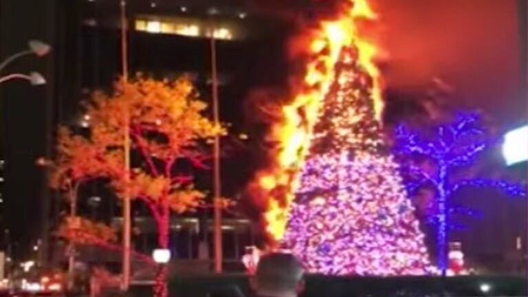 burning christmas tree tradition