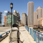 Adobe-Woman-Walking-Bridge-Boston-Seaport