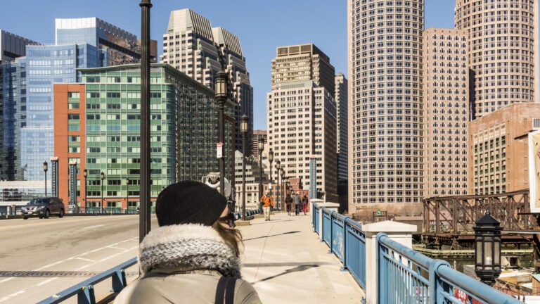 Adobe-Woman-Walking-Bridge-Boston-Seaport