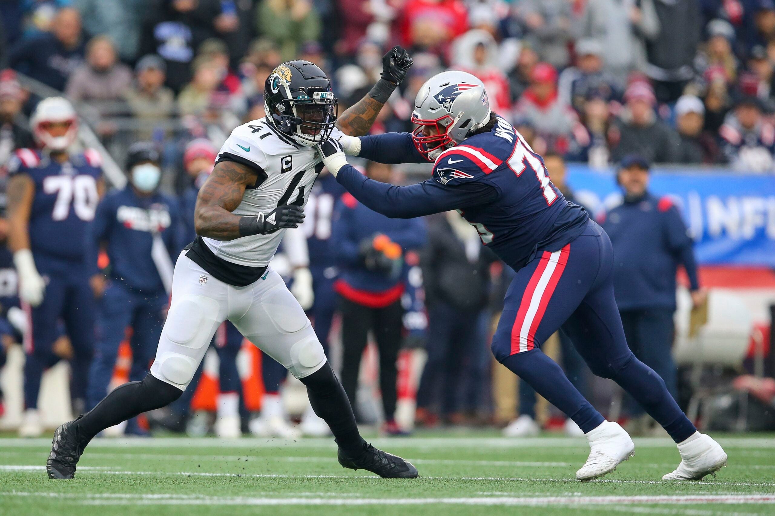 New England Patriots offensive tackle Isaiah Wynn (76) runs on the field  during the first half of an NFL football game against the Green Bay  Packers, Sunday, Oct. 2, 2022, in Green