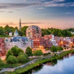 Augusta, Maine, USA downtown skyline on the Kennebec River.