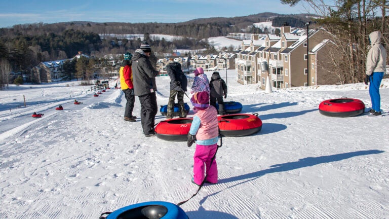 Visitors go snow tubing at Ascutney Outdoors in Brownsville, Vt., in January 2022.