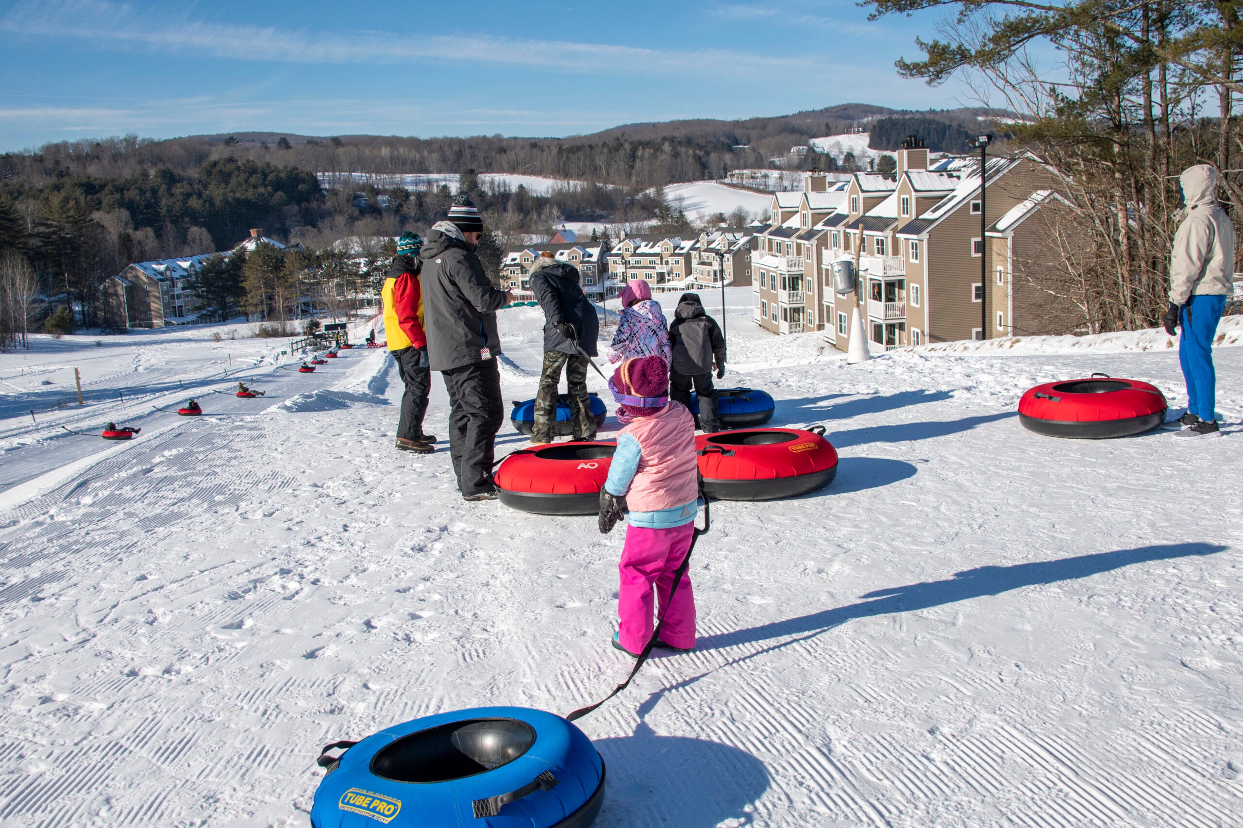 Visitors go snow tubing at Ascutney Outdoors in Brownsville, Vt., in January 2022. 