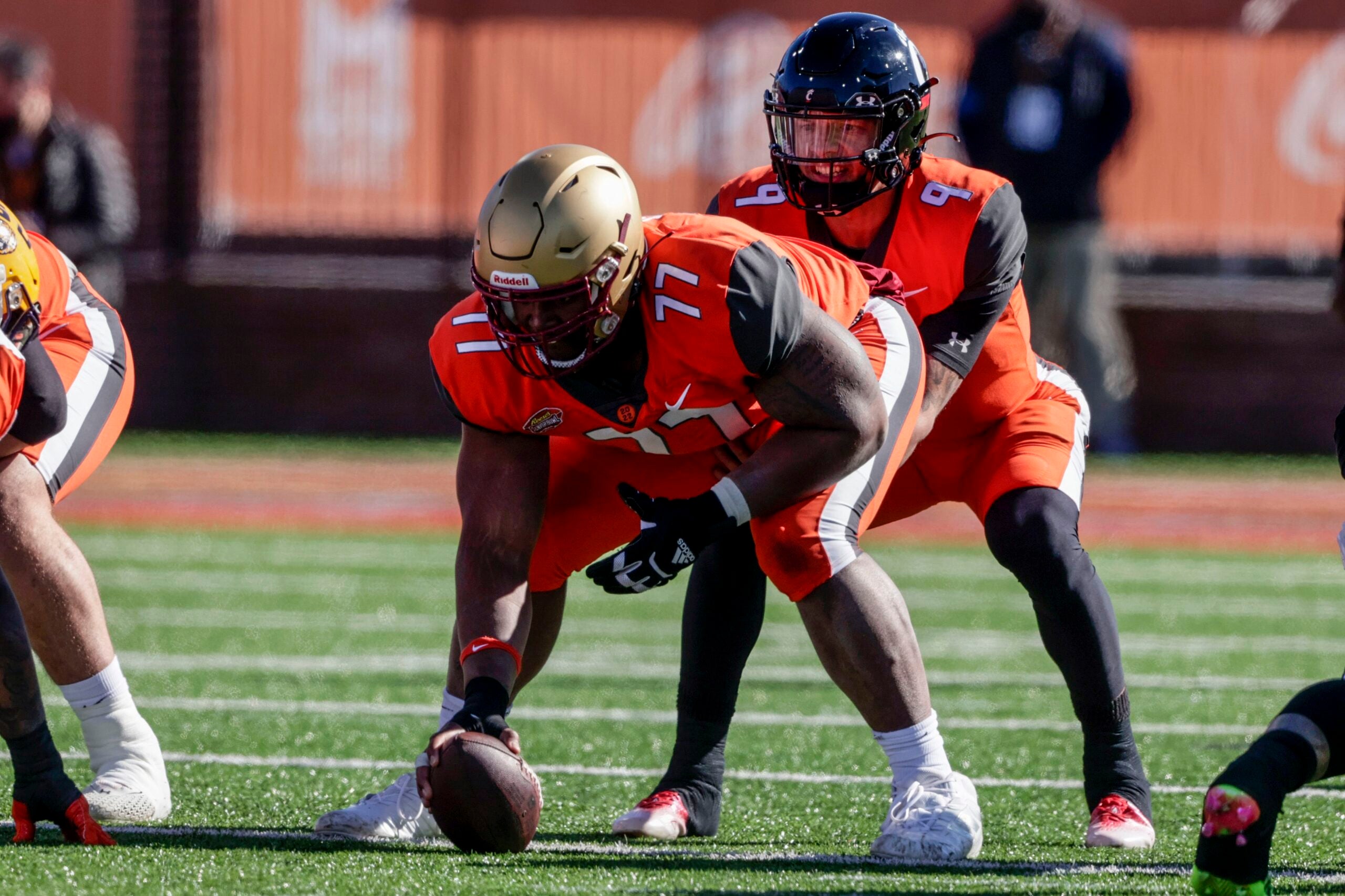 Boston College offensive guard Zion Johnson holds a team jersey