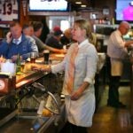 Nicole Eaton is the first female bartender at the quintessential working man's bar, The Eire Pub.