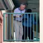 Rob Manfred swinging an imaginary golf club.