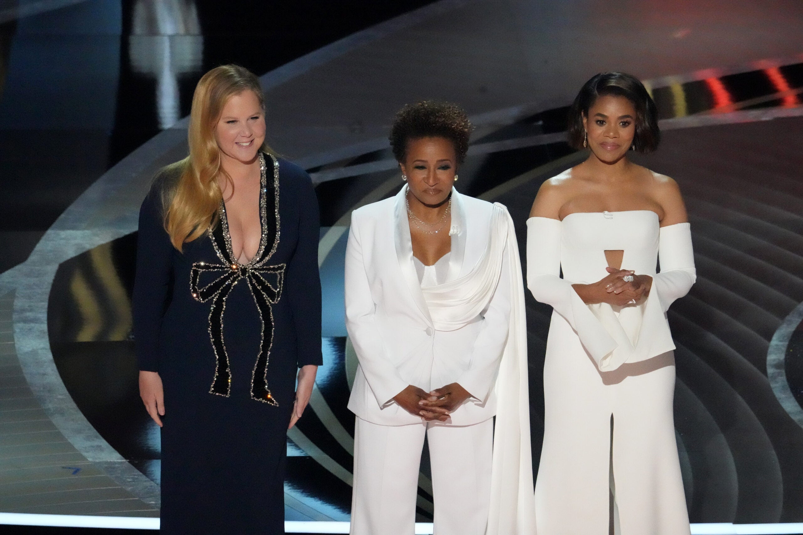 Hosts Amy Schumer, from left, Wanda Sykes, and Regina Hall appear on stage during the 94th Academy Awards at the Dolby Theatre in Los Angeles, on Sunday, March 27, 2022. (Ruth Fremson/The New York Times)