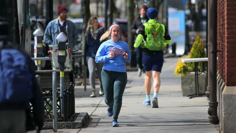 People jogging in Brookline's Coolidge Corner neighborhood.