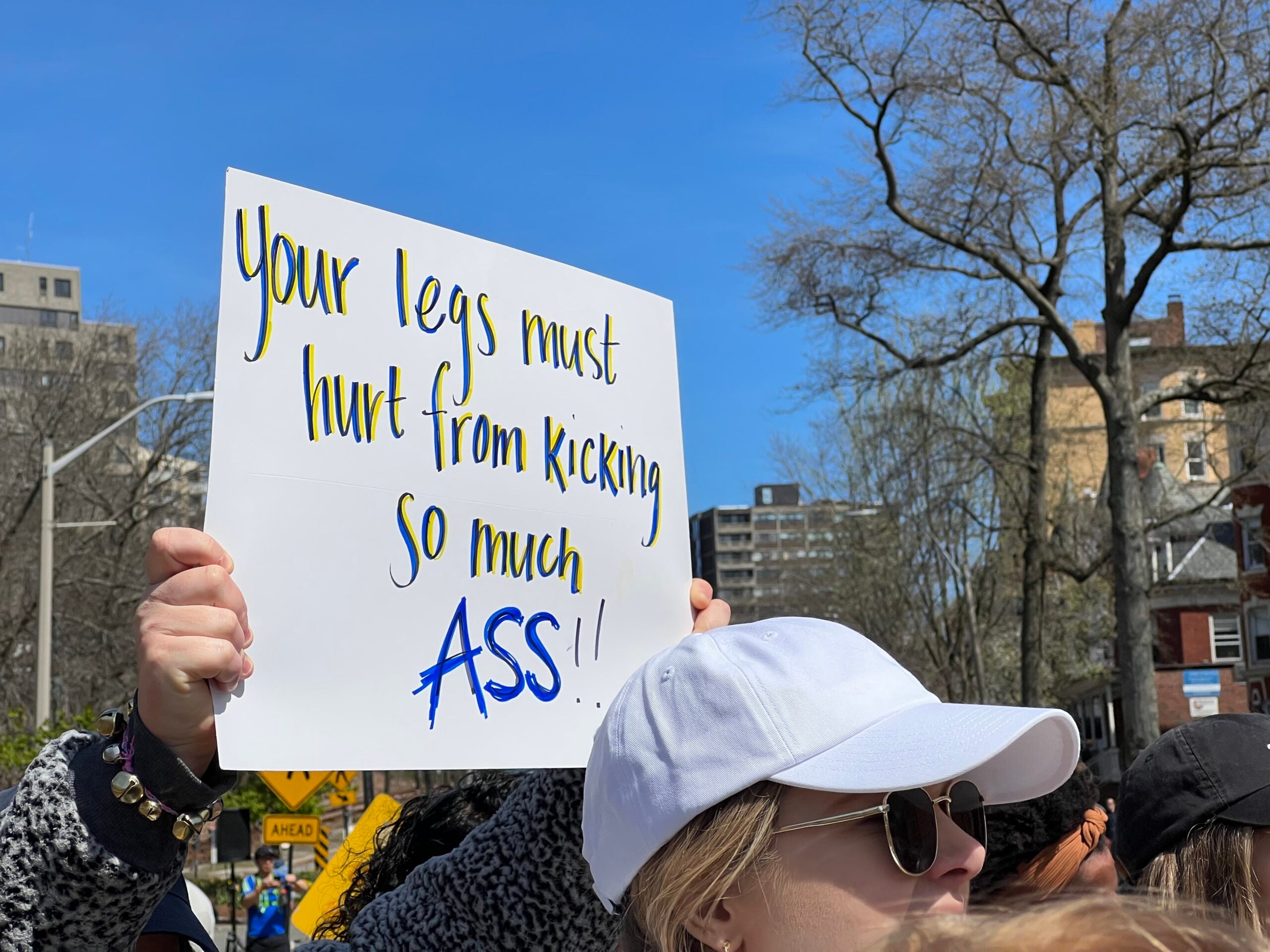 10 readers share their favorite signs along the Boston Marathon route
