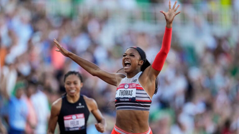 Side view of confident young ethnic lady in sports bra waving